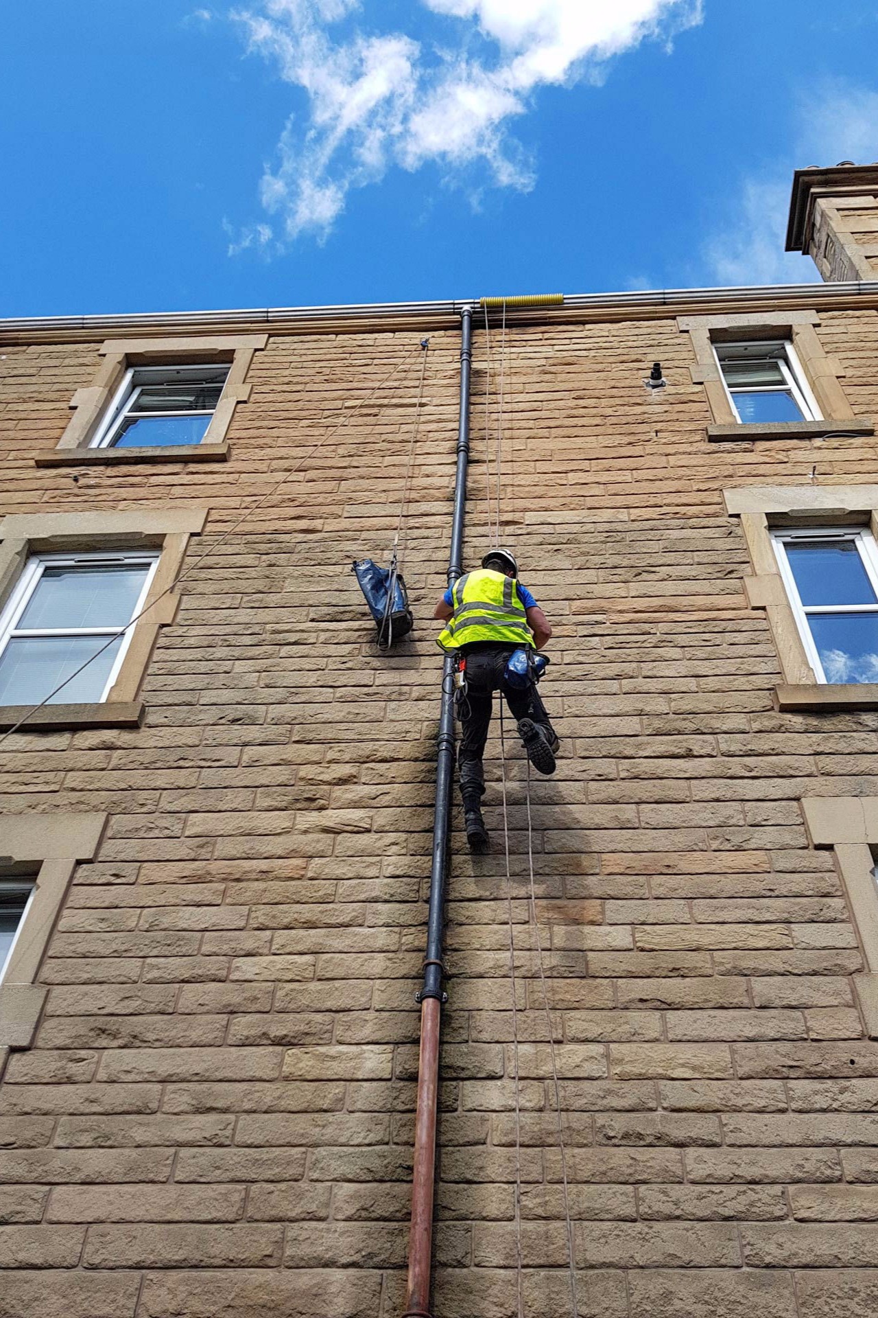 Commercial rope access work on a building